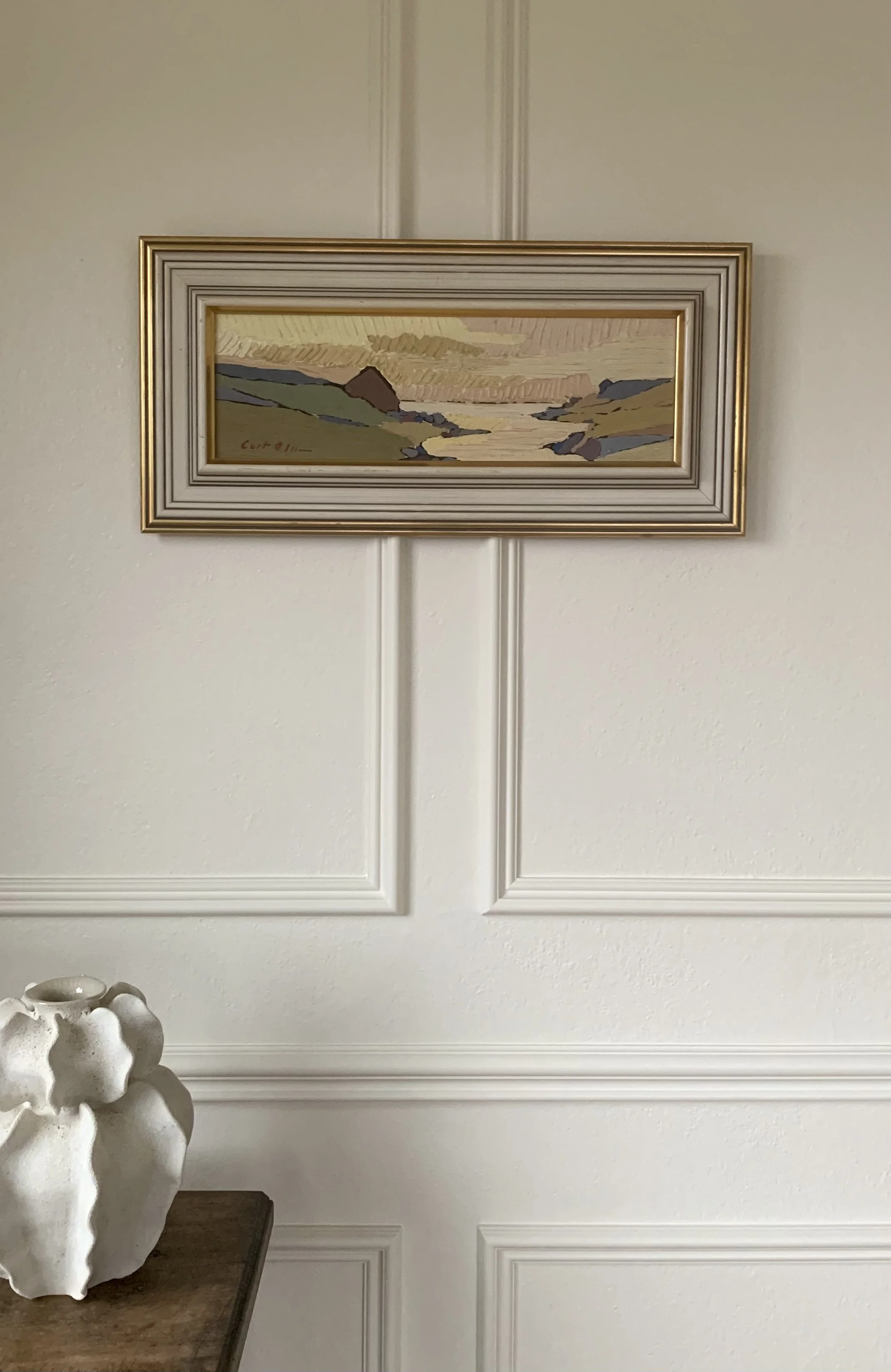 Scandinavian Landscape in Ochre’ (ca. 1960) by Curt Olsson hanging on a wall.