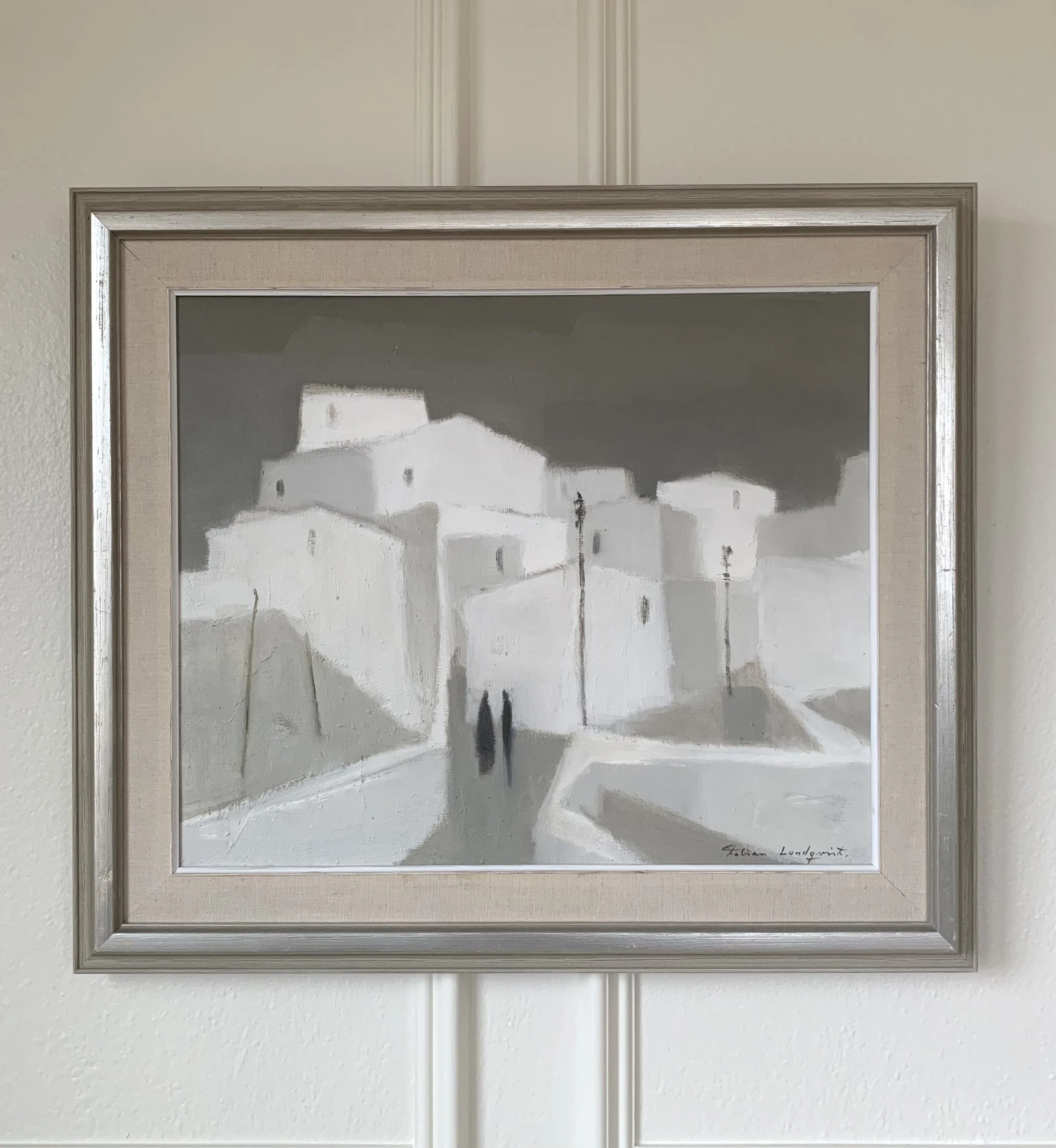 ‘Spanish Village’ (ca. 1960s), a framed minimal modernist oil painting by Fabian Lundqvist showing a tranquil cityscape with two shadowy figures.
