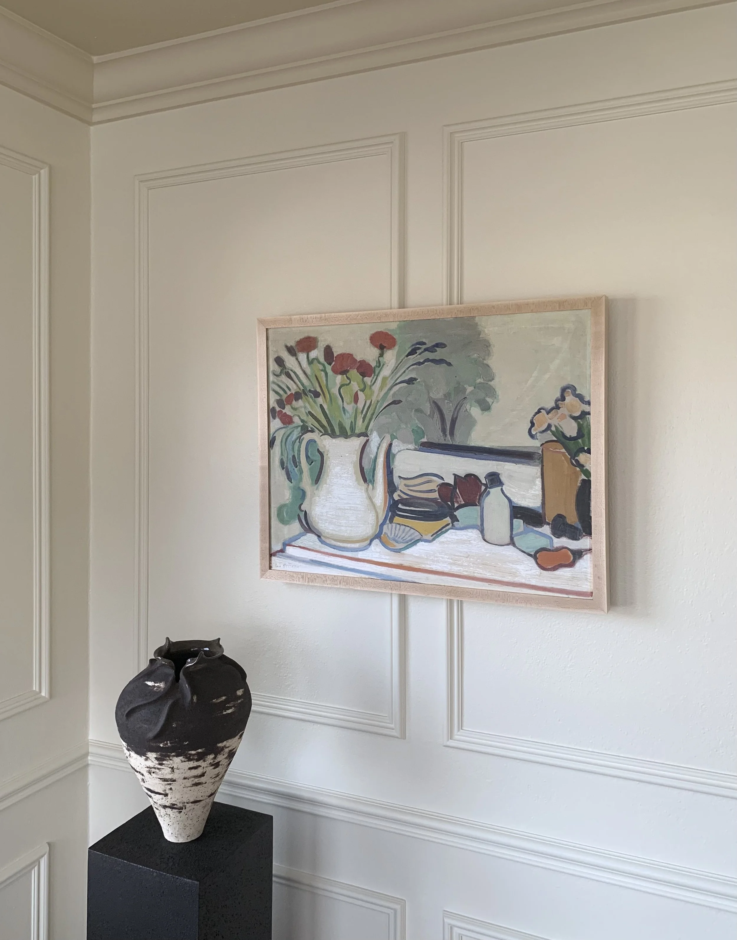 Detail of ‘Vanity Still Life’ (ca. 1960s) by Erik Bystrom, a framed oil painting showing the painting hung on a wall in a room.