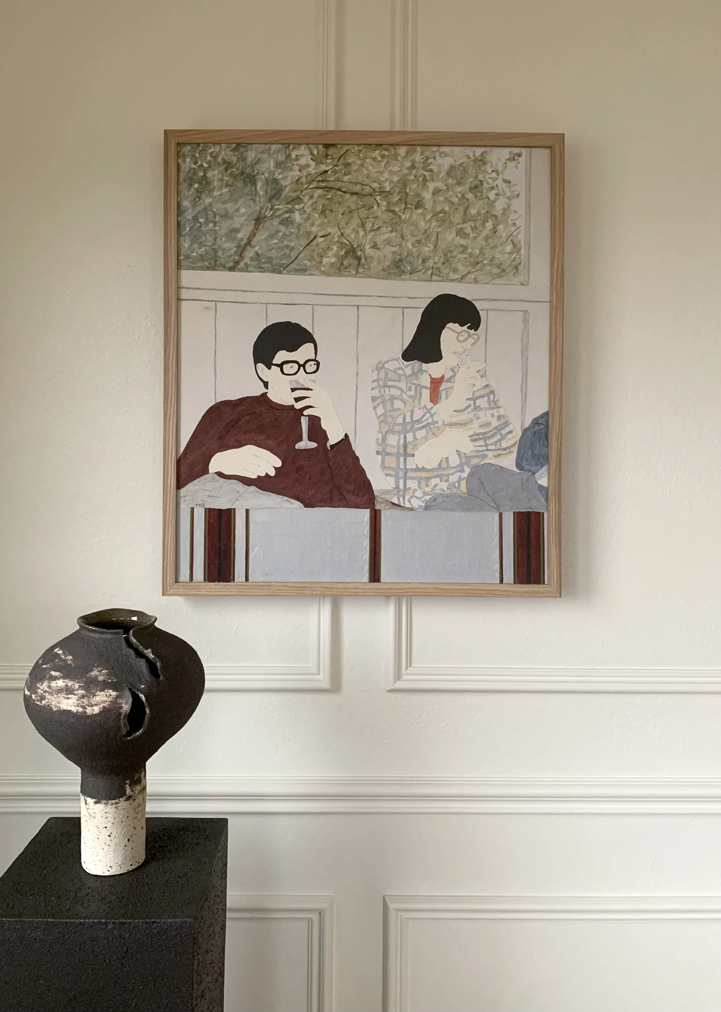 Detail of ‘Double Portrait’ (1975), a framed oil painting by Rolf Pettersson showing the artwork hung on a wall in a room.