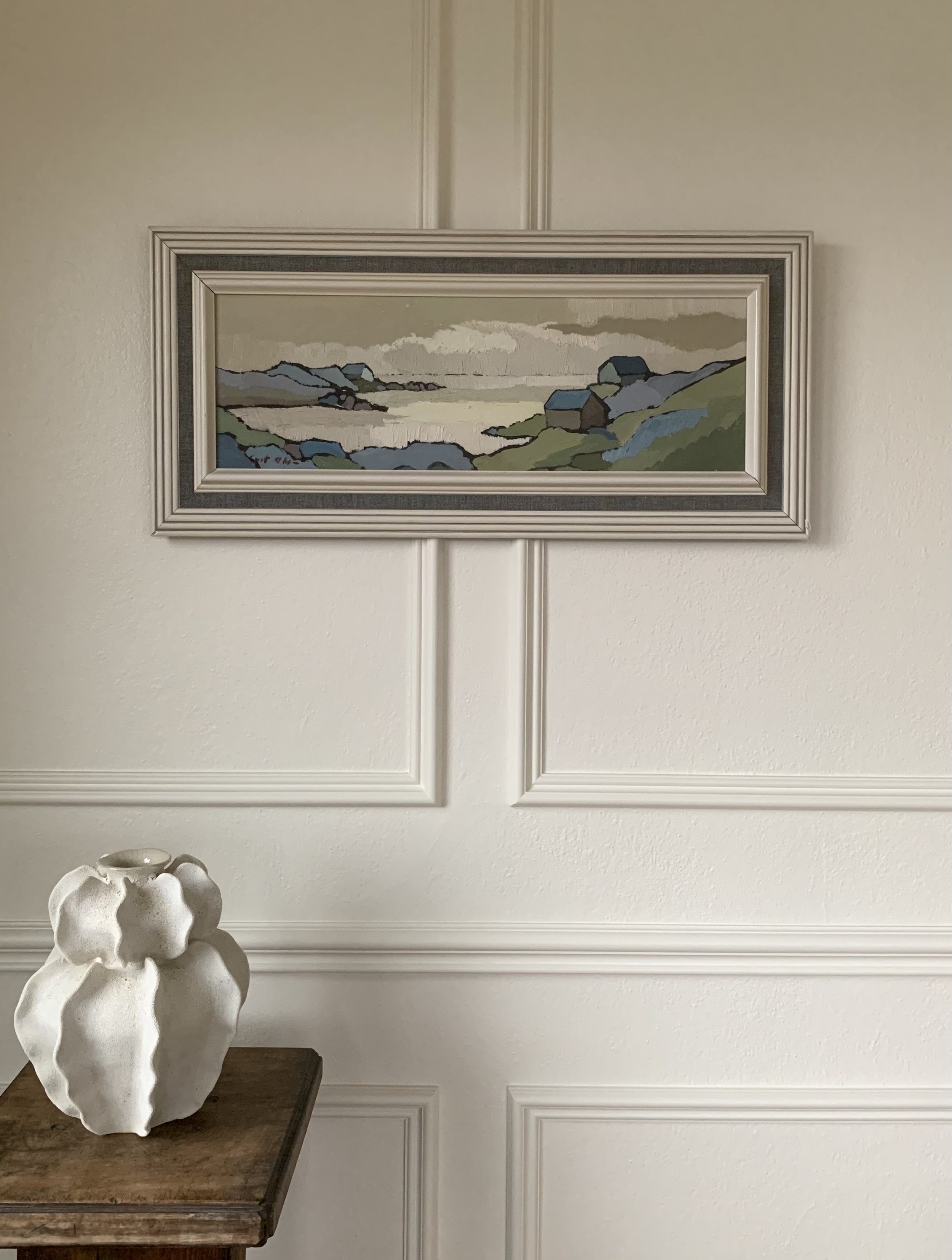 Detail of ‘Scandinavian Landscape in Blue and Green’ (ca. 1960) by Curt Olsson, hanging on a wall.