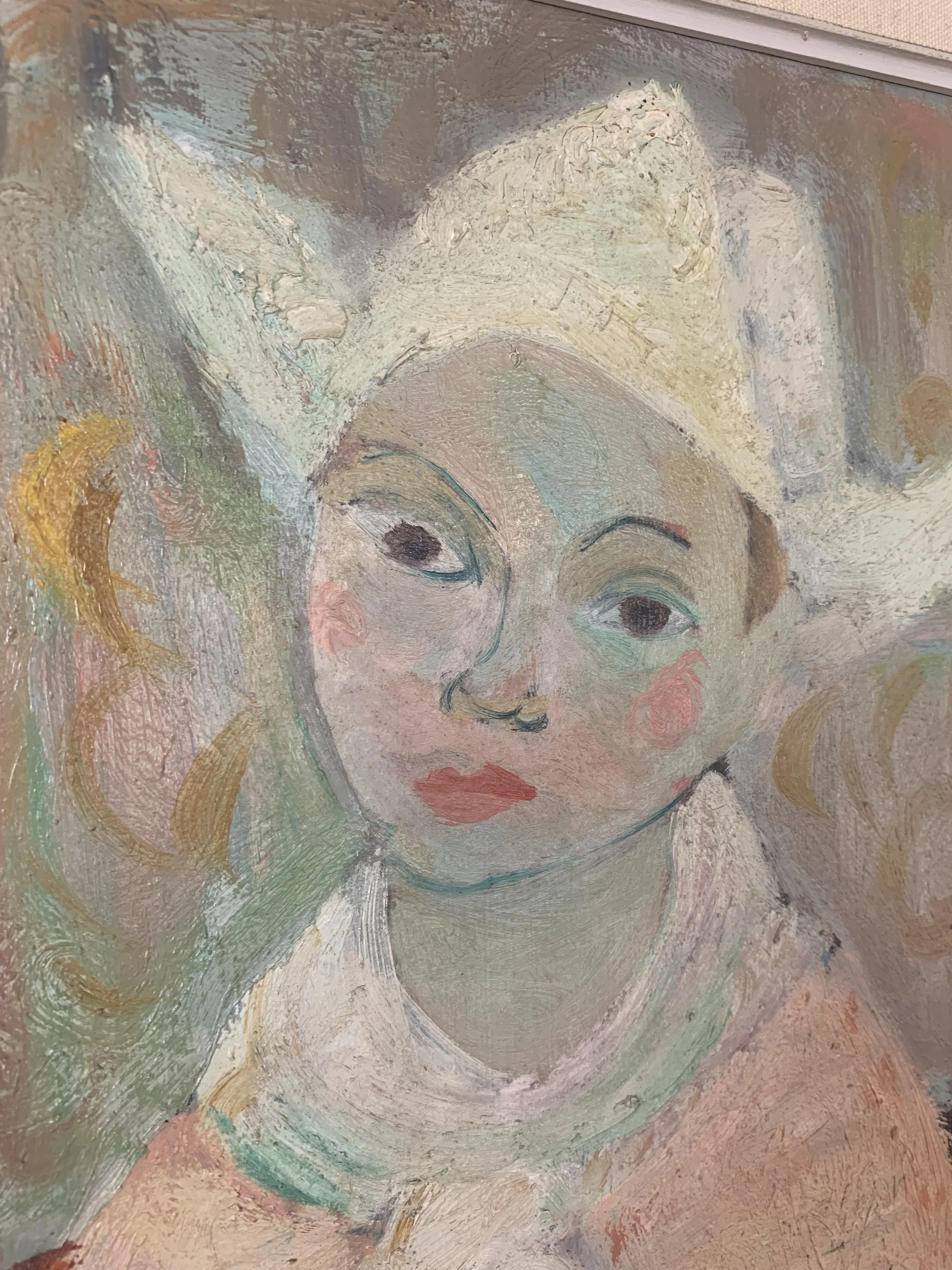Detail of ‘Young Woman in Hat’ (ca. 1940s) by Eric Elfven, a framed oil painting showing a closeup of the woman's face.