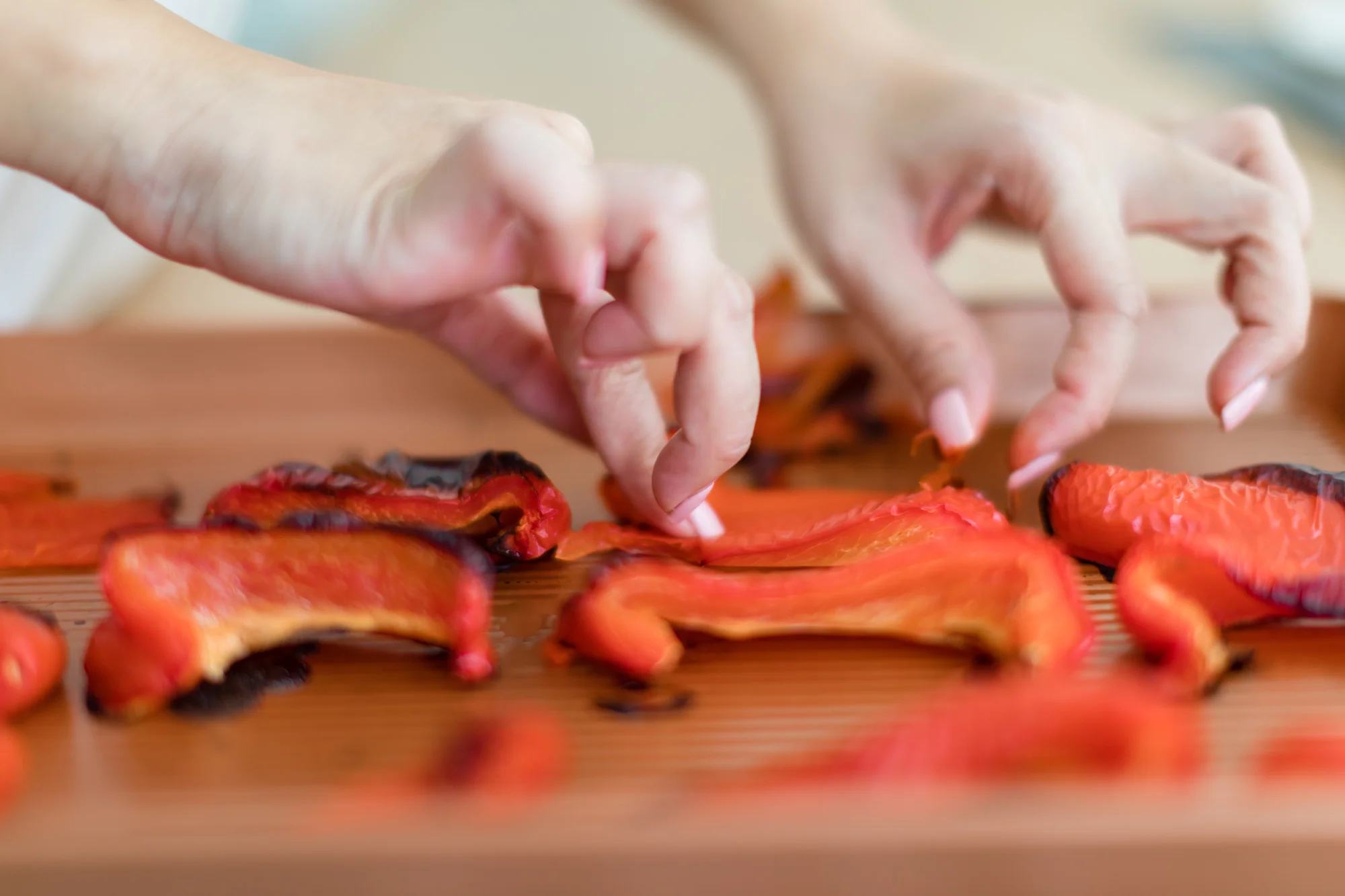 Quarter the red peppers, place them skin side up and roast them in the oven till brown to remove skin.