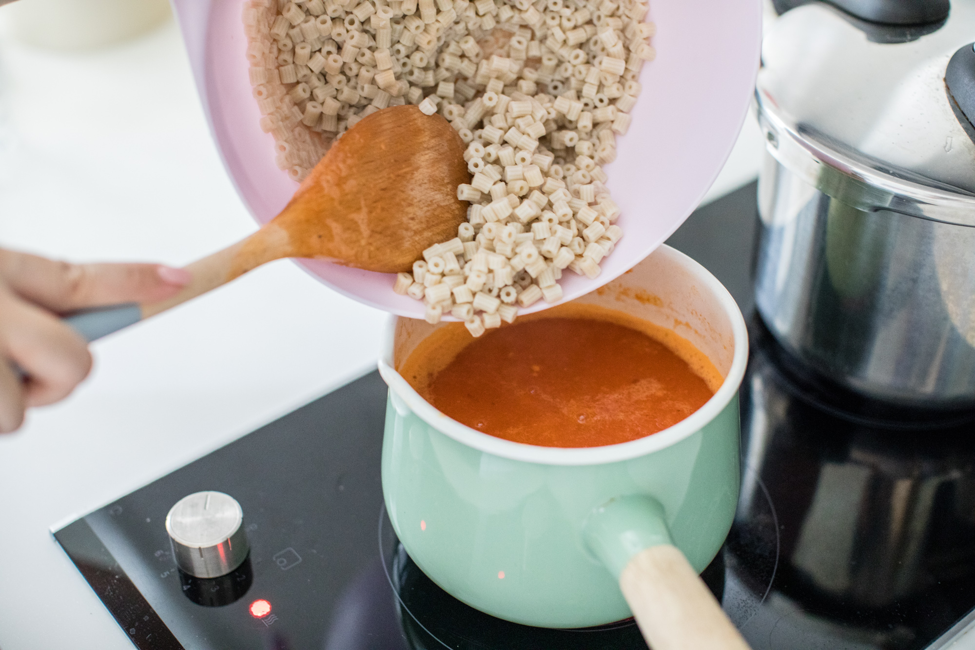 Pour soup back into pot, reheat and add in the cooked spelt macaroni.