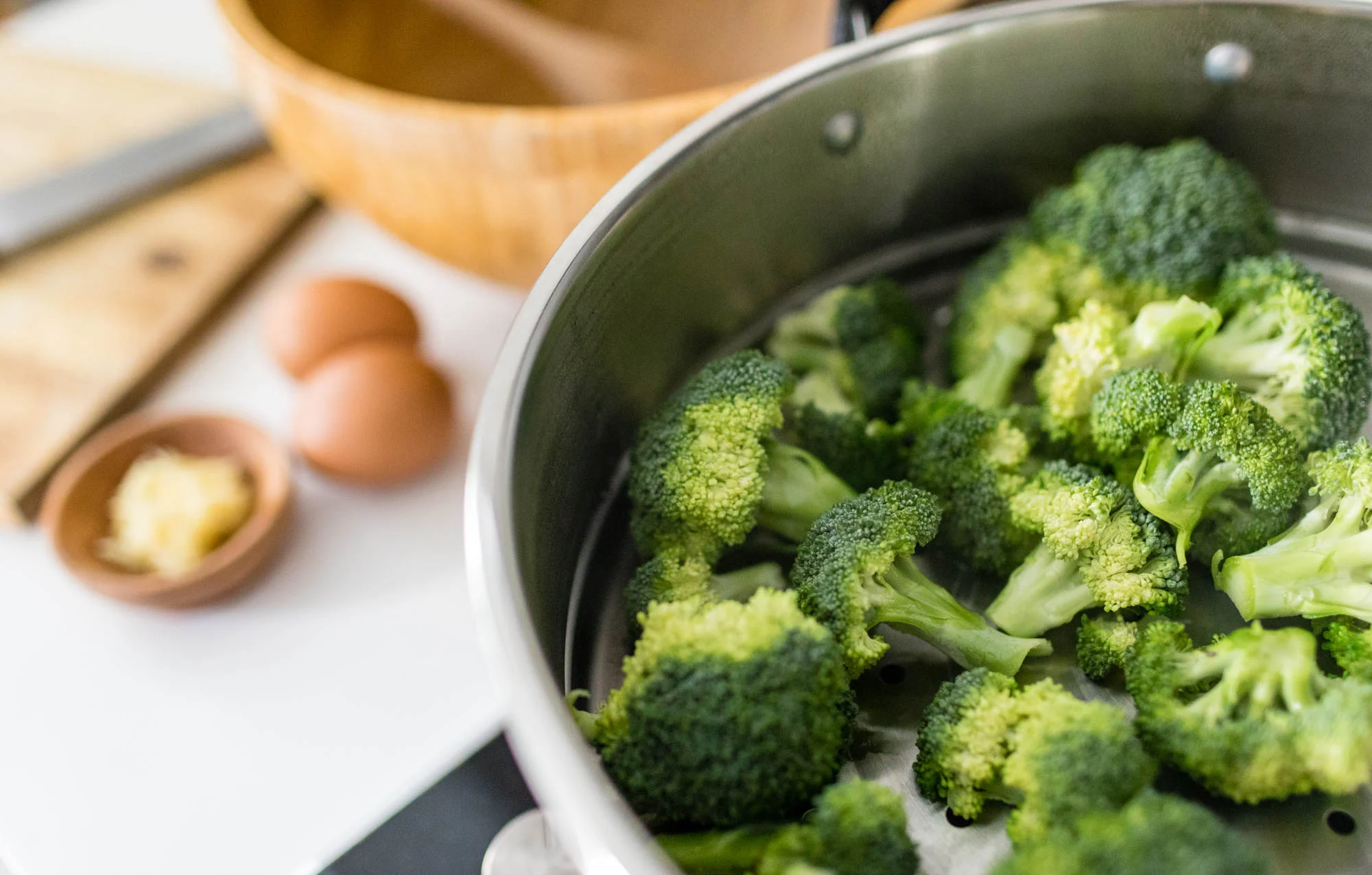 Steam broccoli florets till soft. Chop it up finely.