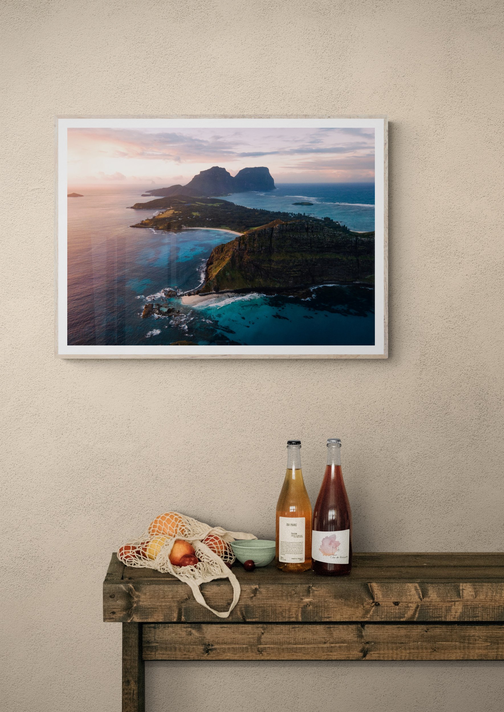 Wine_bottles_sitting_on_rustic_table.jpg