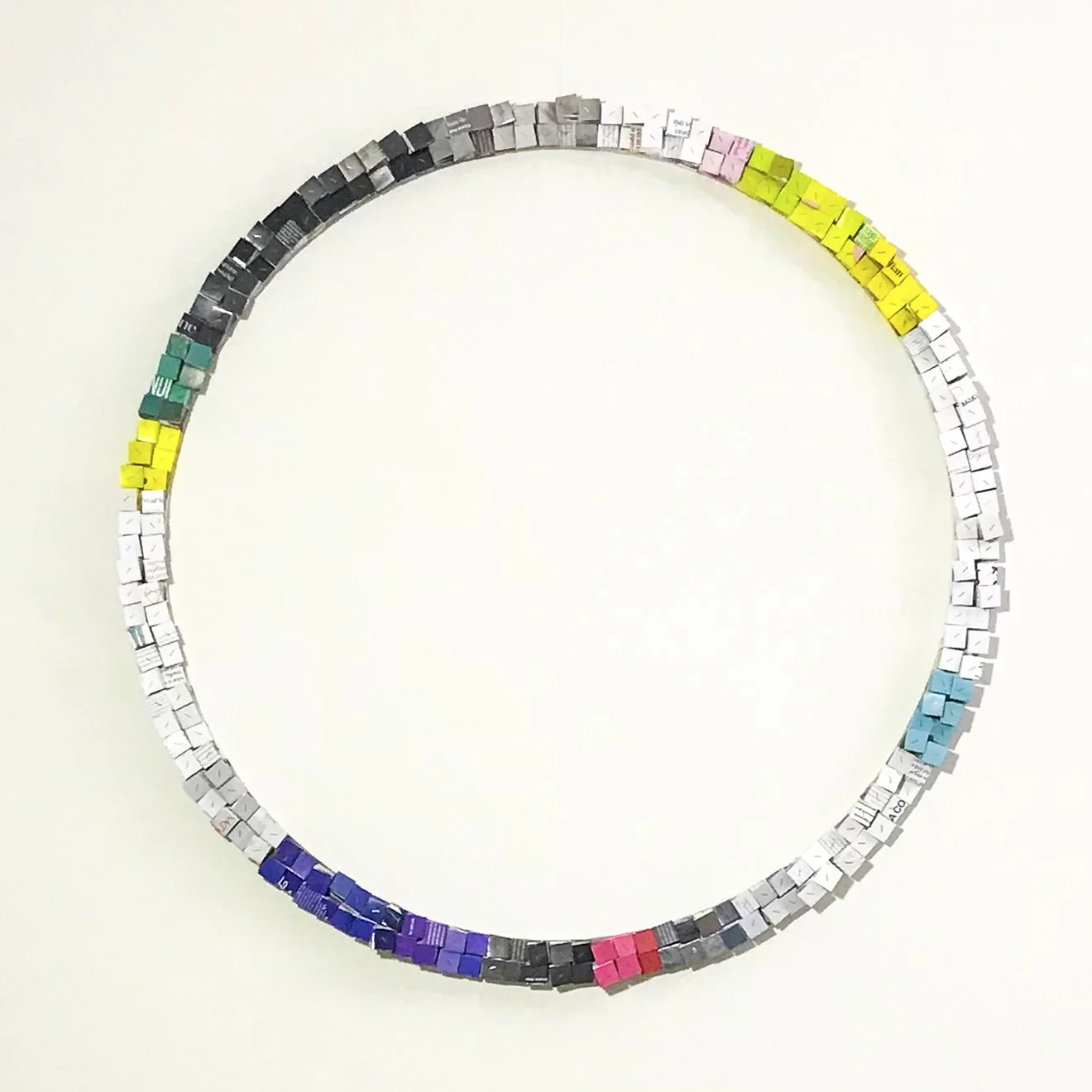 GOING IN CIRCLES #1, abstract paper collage by Paola Bazz, handcrafted with recycled magazines for boutique interiors.