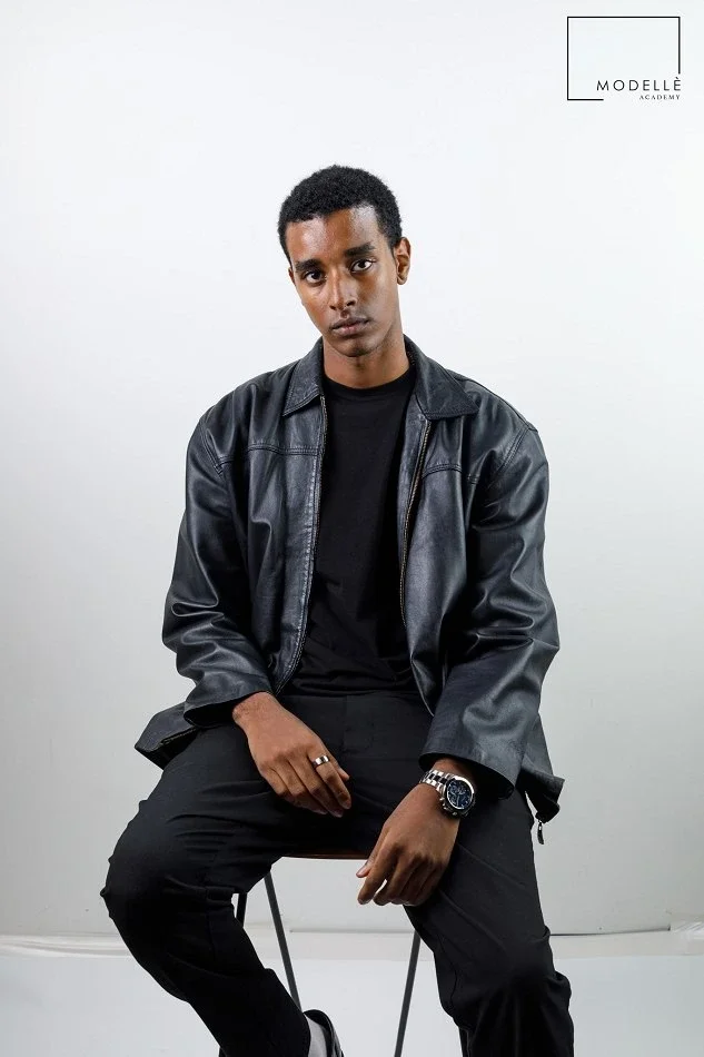 Male model demonstrating confidence, professional presentation and posing skills in a studio photoshoot