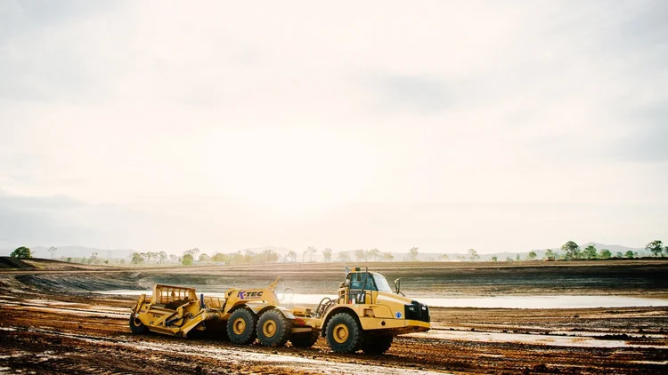 A K-Tec 1237 working a civil earthworks job in Queensland at dusk.