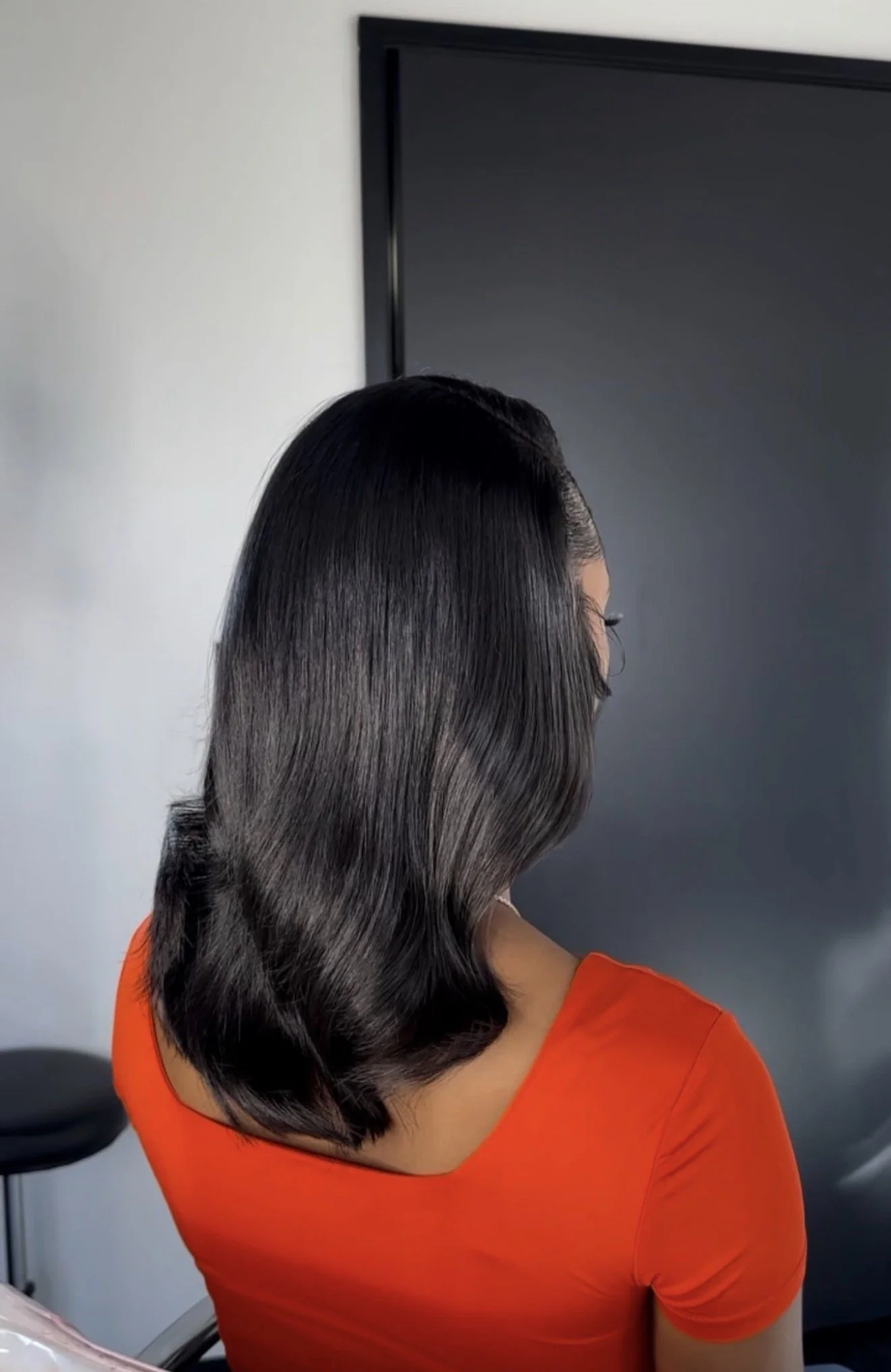 Finished shoulder-length silk press styled by Beautiful Luxe School of Cosmetology student Charniece, demonstrating precision cutting and healthy hair results.
