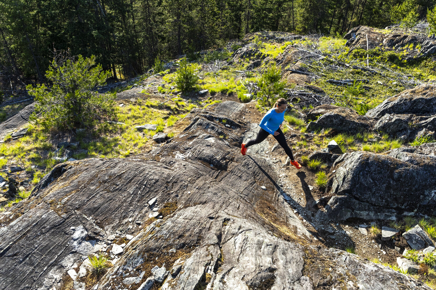  Jumping from rock to rock, coming up a steep section of trail. 