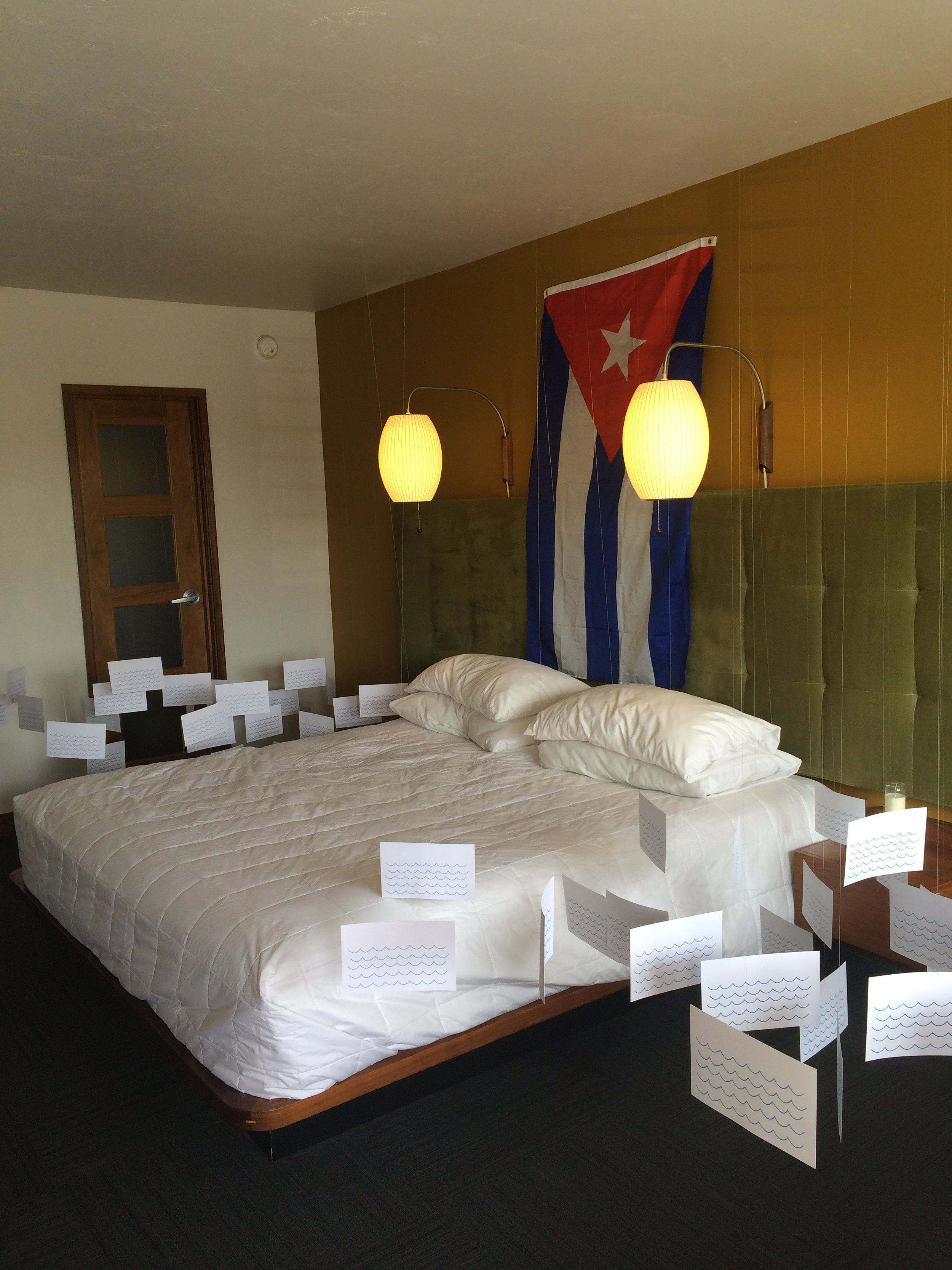   90 Miles  (performance at Modern Art), Dimensions &amp; Time Vary, Communist Manifesto, Peter Pan, White Cloth, Megaphone, &amp; Cuban Flag, 2016 Photo: Juventino Aranda 