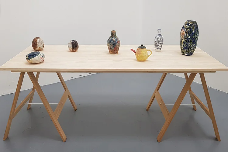 Image credit: Naomi Allan,  Feel Free to Eavesdrop Love , pine table and 7 thrown ceramic pieces, dimensions variable, Wallace Arts Trust Collection.