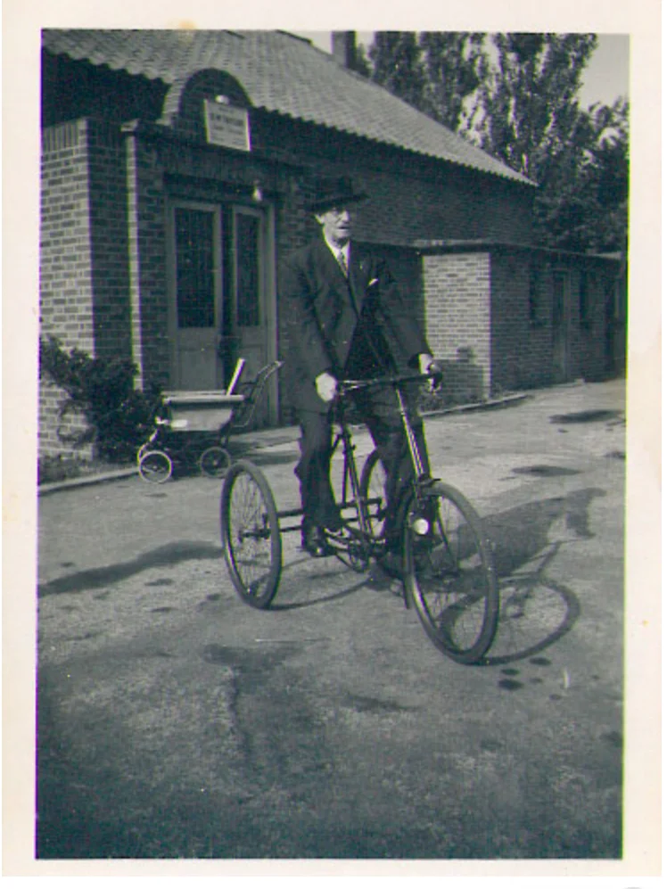 Mr Mussett, caretaker, on his tricycle (1950)