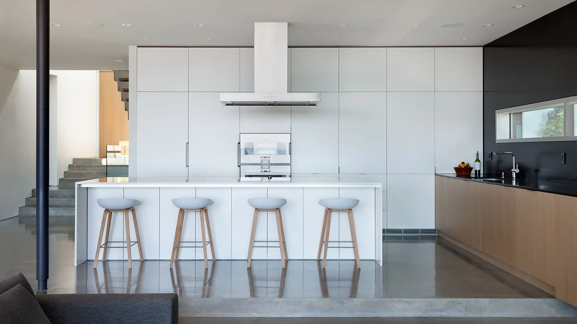  Contemporary sophisticated minimalist residential house interior kitchen with natural stone, concrete and wood 