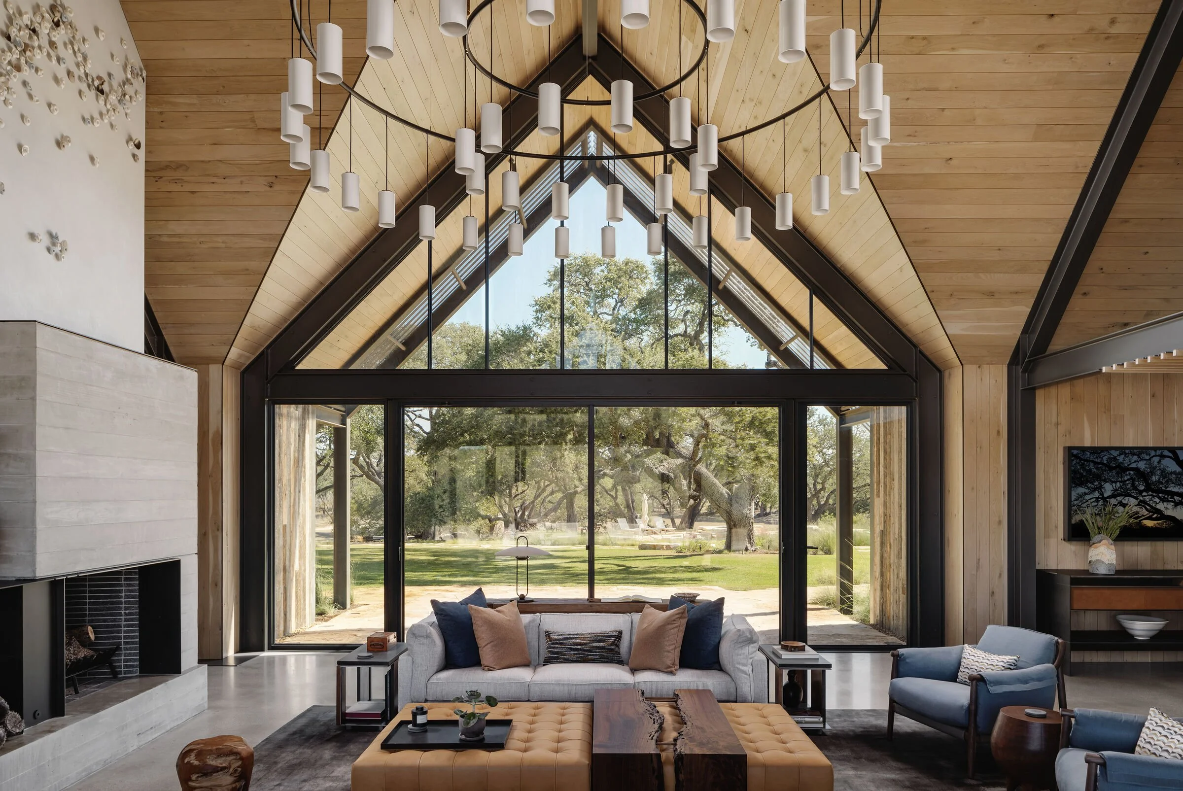  Contemporary sophisticated minimalist residential house interior lounge with natural stone and wood 