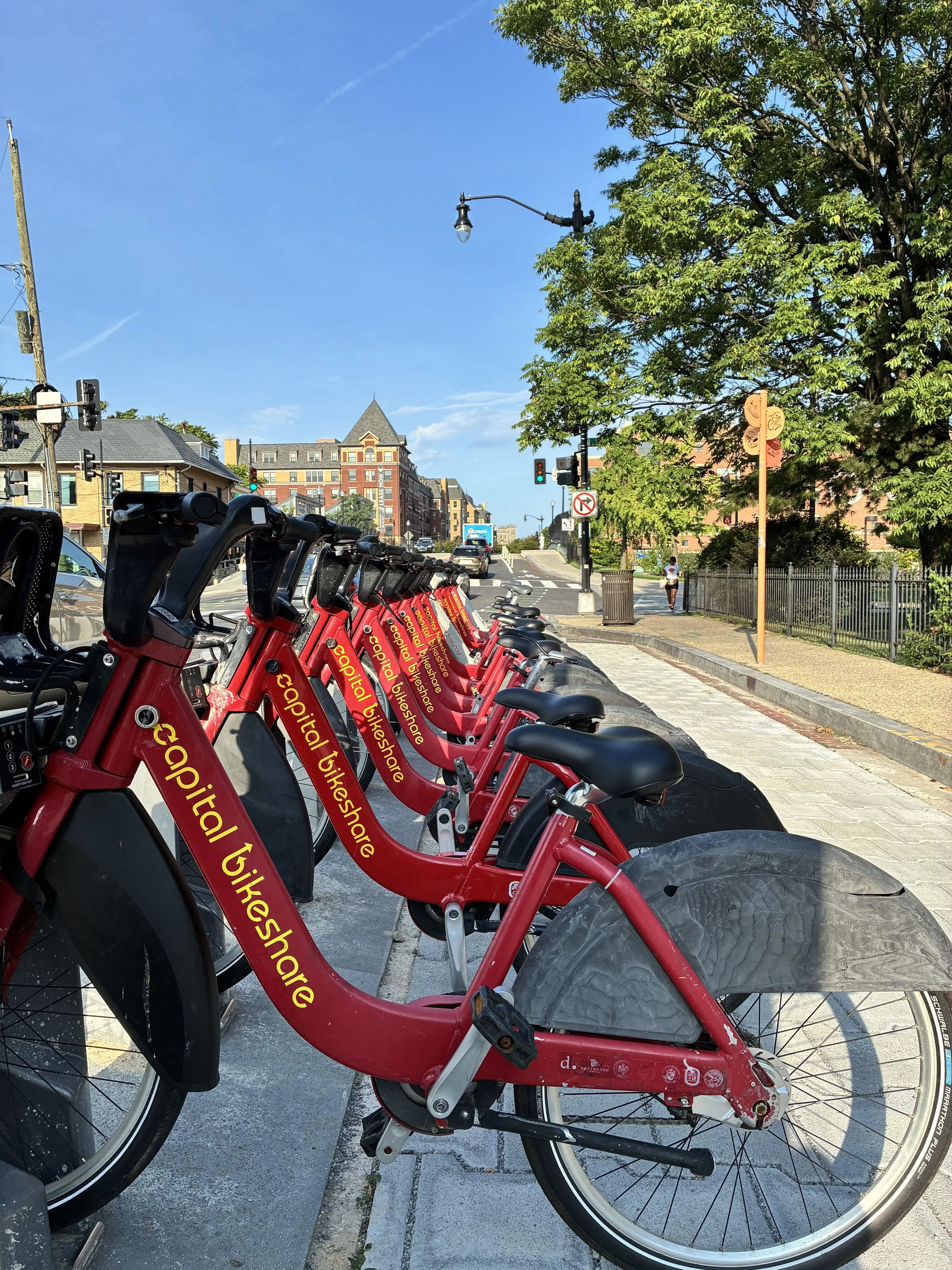 Red bikes docked with the text, "Capital Bikeshare"