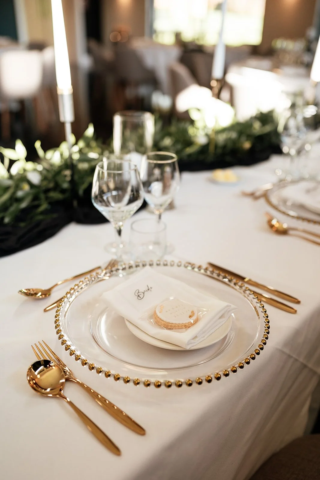 Wedding table styling with gold charger plate and gold cutlery in Leicestershire