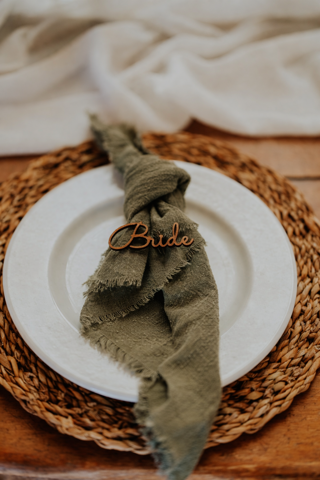 Wedding table styling with charger plate napkin and place name in Leicestershire