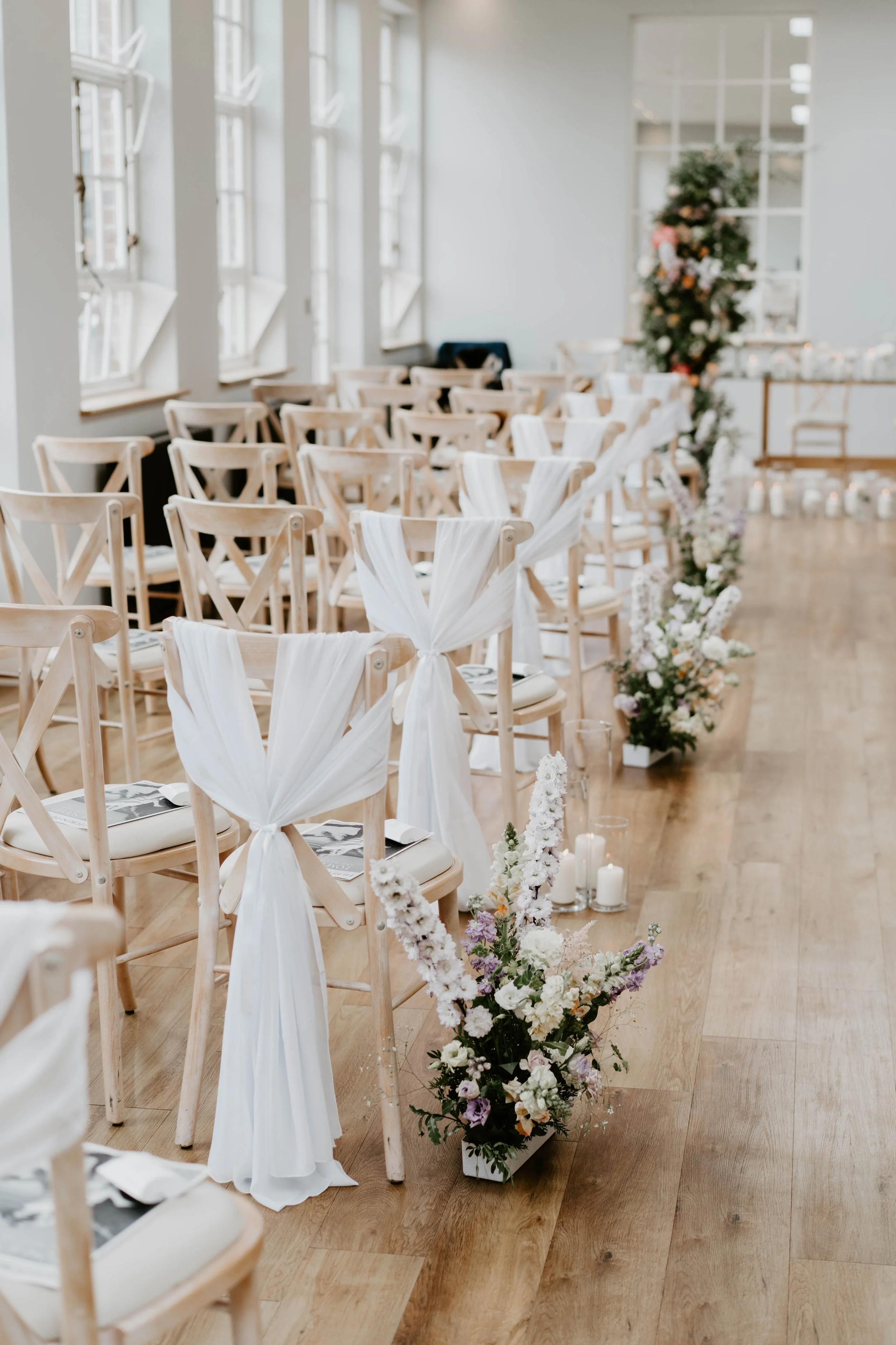 Ceremony aisle, decoration with chair, drapes, Flowers and candles