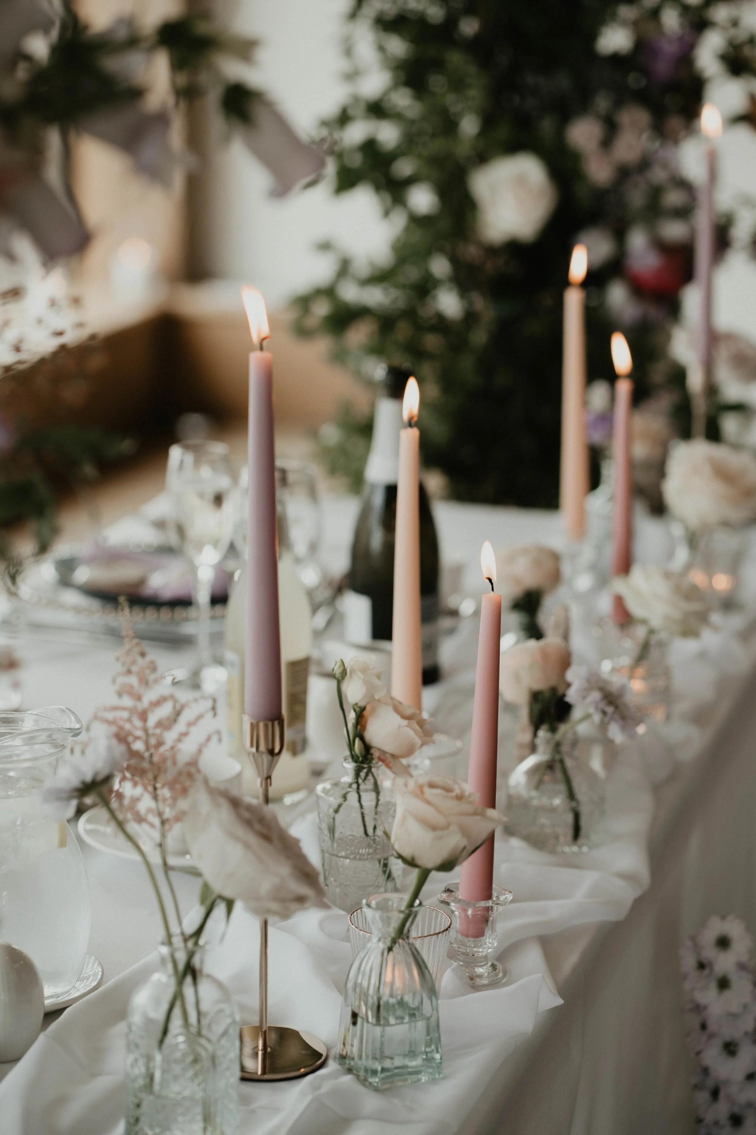 Wedding top table decoration with candles and flowers