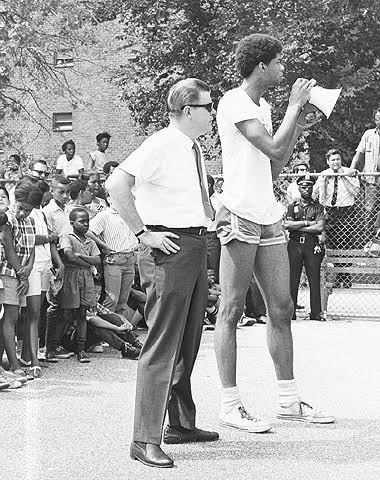 Kareem Abdul-Jabbar kicks off the summer basketball clinic at the Marcy Houses in Bedford-Stuyvesant, Brooklyn, July 23, 1968. New York City Housing Authority Collection, LaGuardia and Wagner Archives.