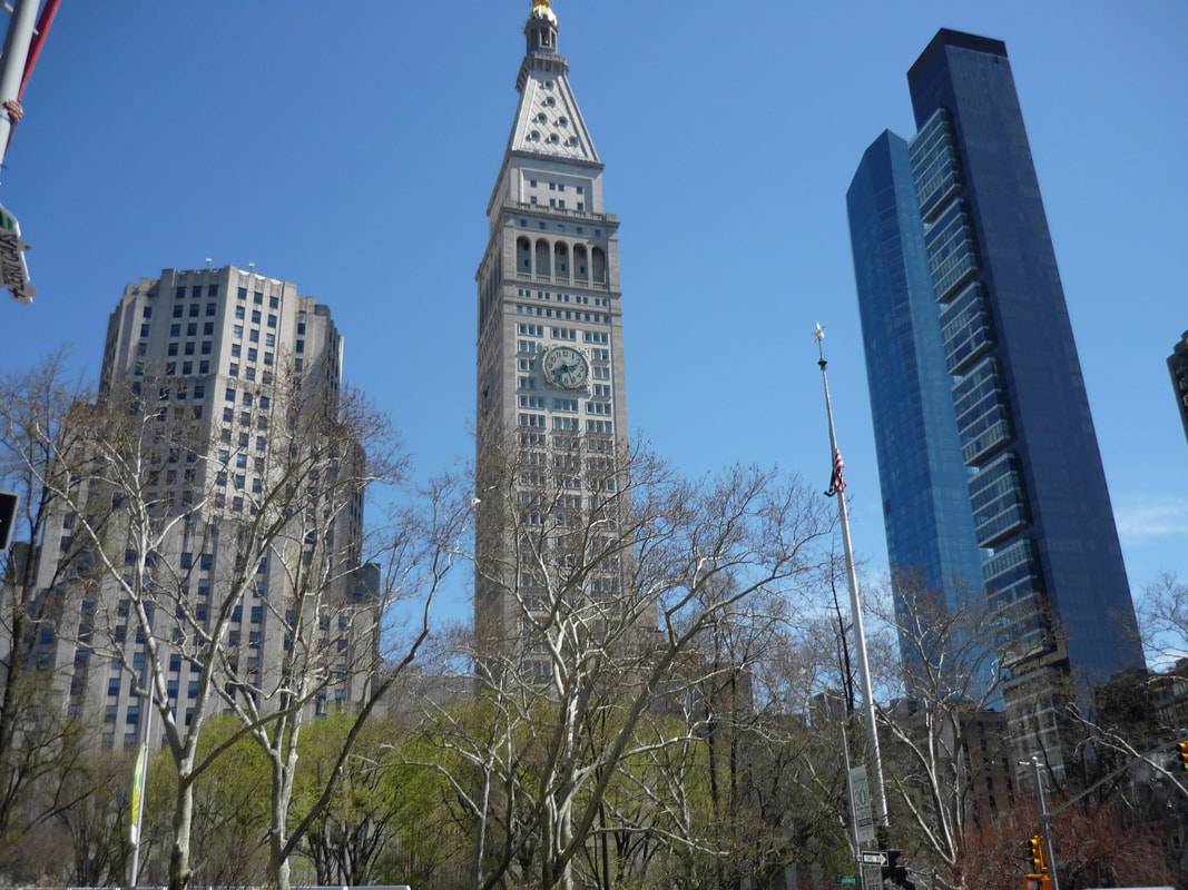 Three generations of architecture flanking Madison Square Park.