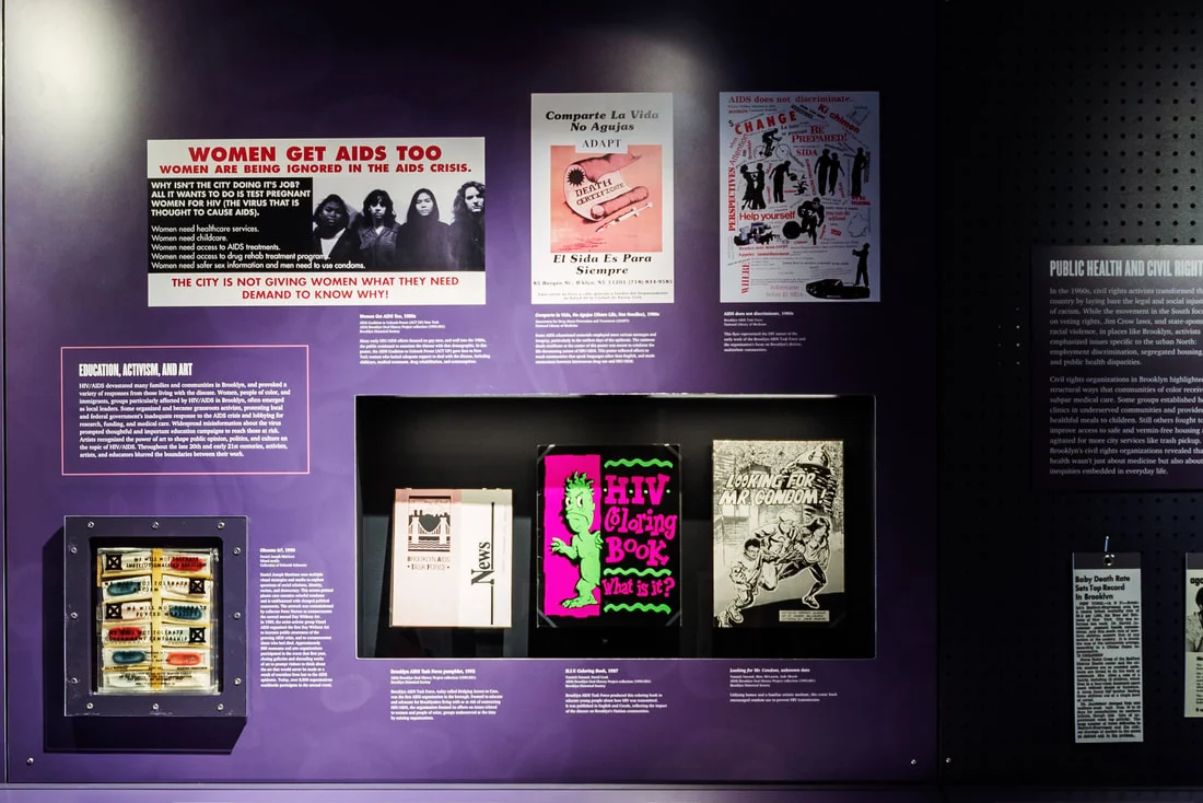 Coloring book, comic book, newsletter, posters, and art piece related to HIV/AIDS in Brooklyn, all 1980-1990s; Taking Care of Brooklyn exhibition, 2019; Brooklyn Historical Society.