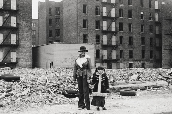 Mother and daughter outside their home. Credit: Mel Rosenthal