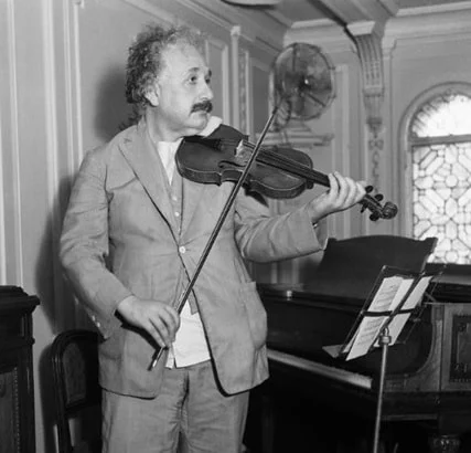 Albert Einstein performs a sonata on his violin.