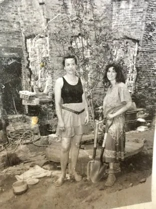 Sue Strande and Marisa DeDominicis gardening in Sunnyside Garden 543 E 13 Street located between 2 squats.