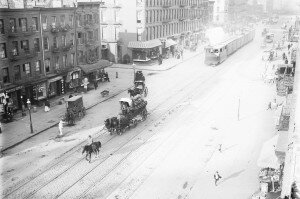 Working in the Kitchen. Economic activity on Eleventh Avenue includes a street cleaner, draught driver, engine operator, and the "West Side cowboy" hired to precede the trains. (George Grantham Bain Collection, Library of Congress)