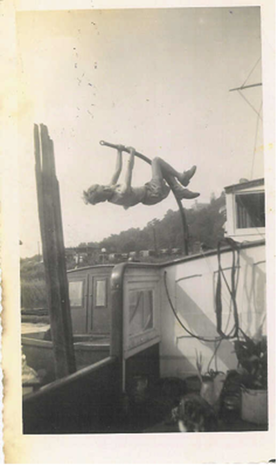 BILL’S LITTLE BROTHER, CONRAD ISECKE, SWINGING FROM THE NE-WI-MA’S DAVIT AT DYCKMAN STREET BERTH