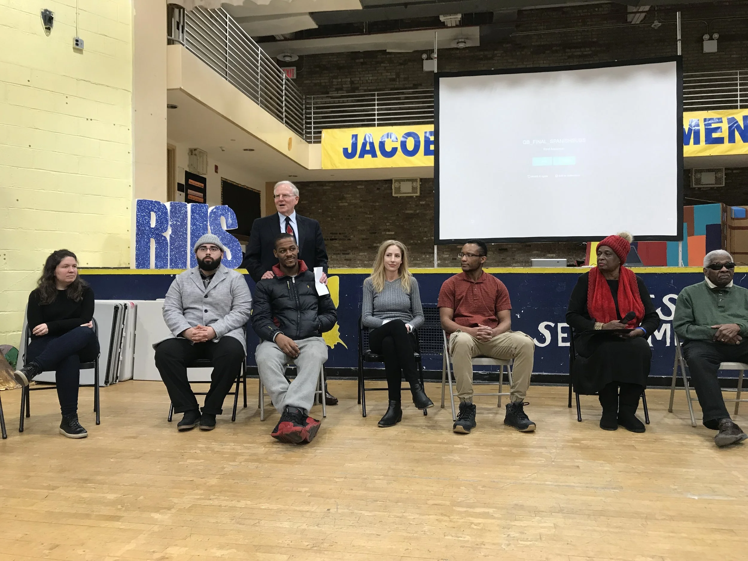Students and residents hold a discussion of short documentary Voices of Queensbridge , at the Jacob A. Riis Neighborhood Settlement at Queensbridge Houses. Photo by Molly Rosner.