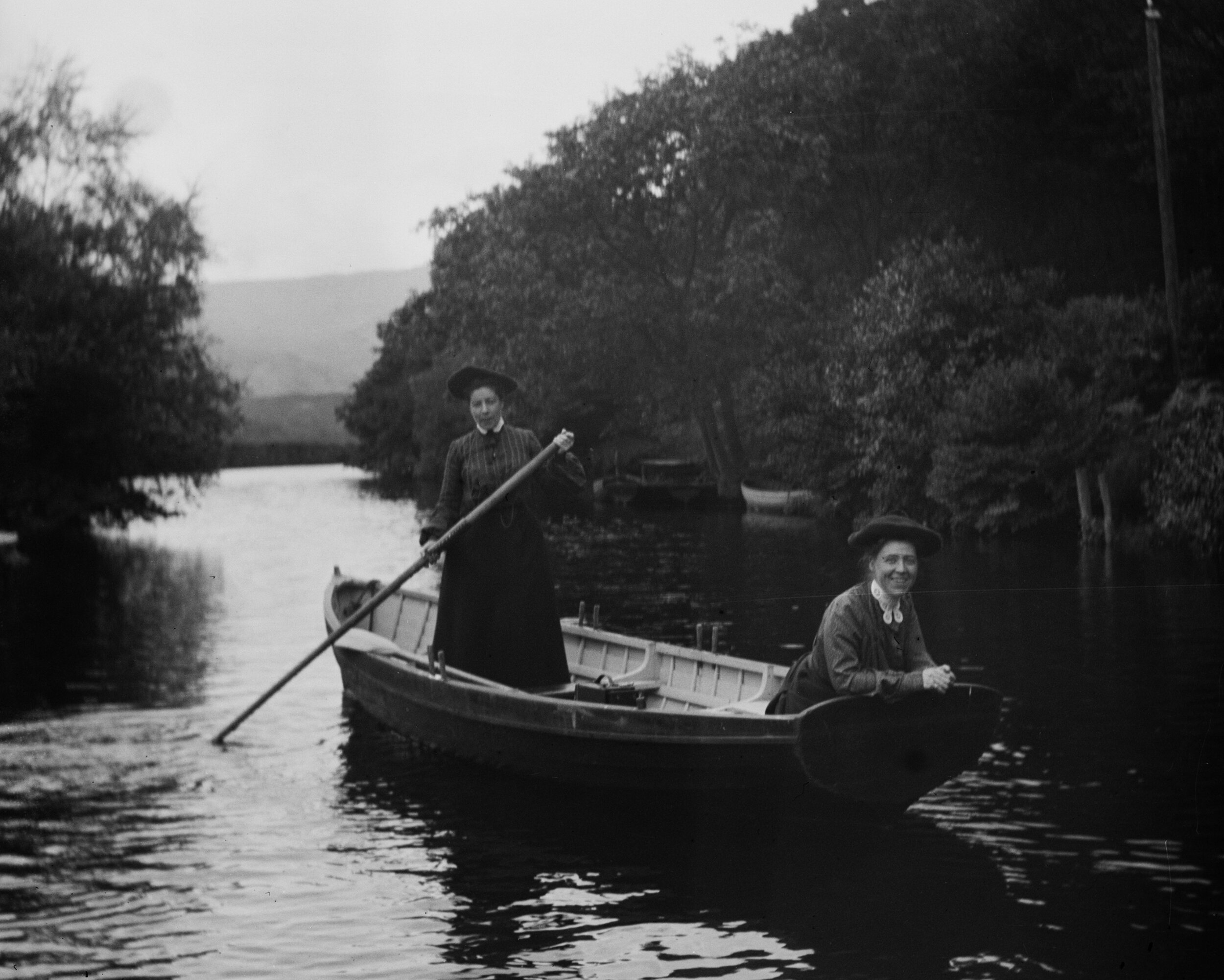   [Alice Austen and Gertrude Tate in a rowboat, The Trossachs, Scotland] 1903  Collection of Historic Richmond Town, 50.015.3562 