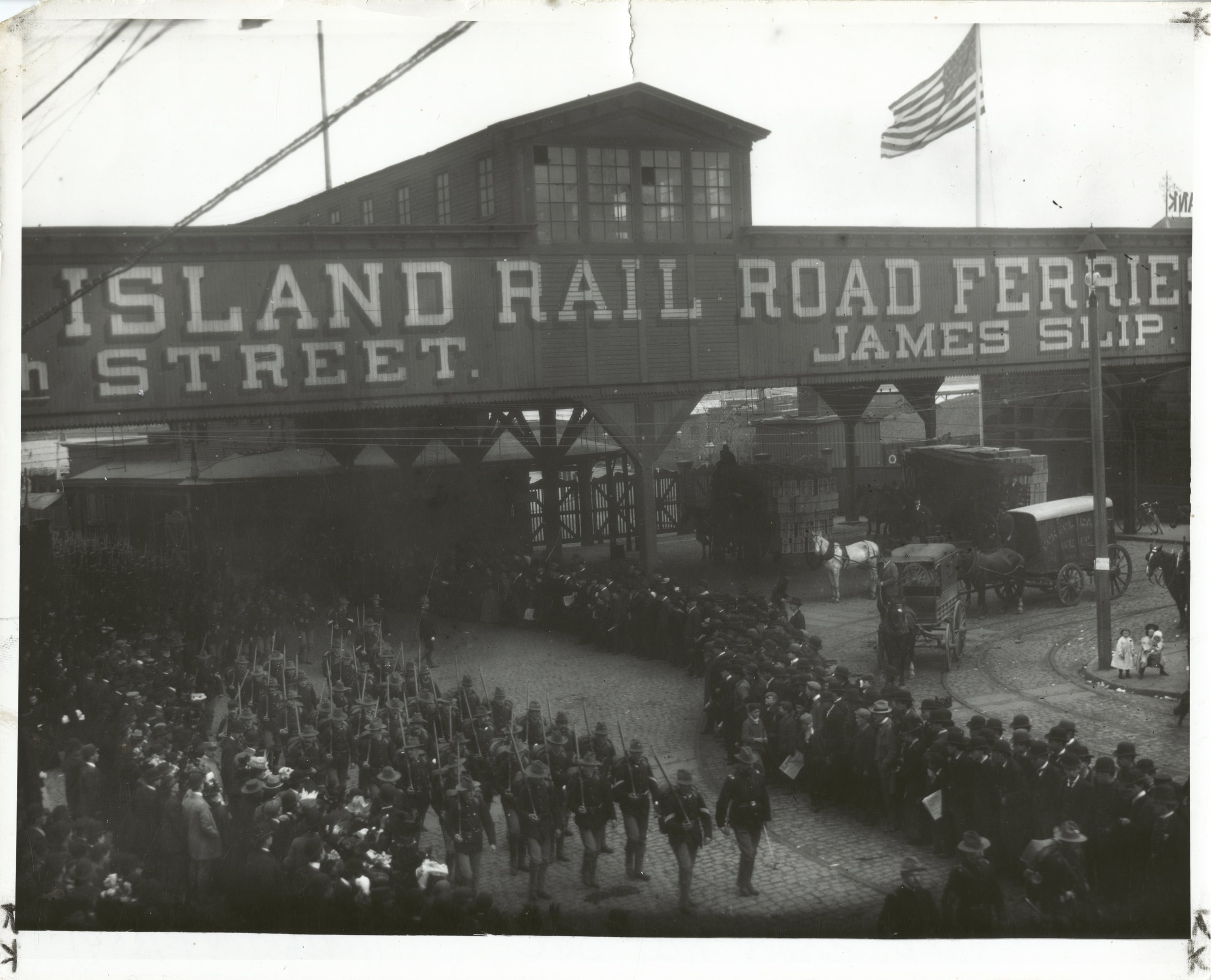  Spanish-American War Veterans at Long Island City Ferry Terminal on their return from Cuba, entraining for Long Island camps, 1898. Hal B. Fullerton. Courtesy Queens Borough Public Library. 