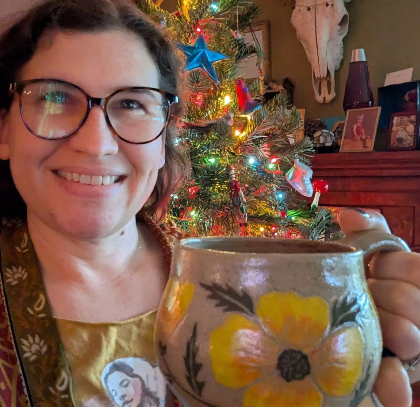 Drinking my Christmas Eve coffee out of my brand new mug! I just got my newest batch of pottery out of the kiln. I learned a lot and will make adjustments, but overall I'm really happy with the results.  I made this California poppy mug especially fo