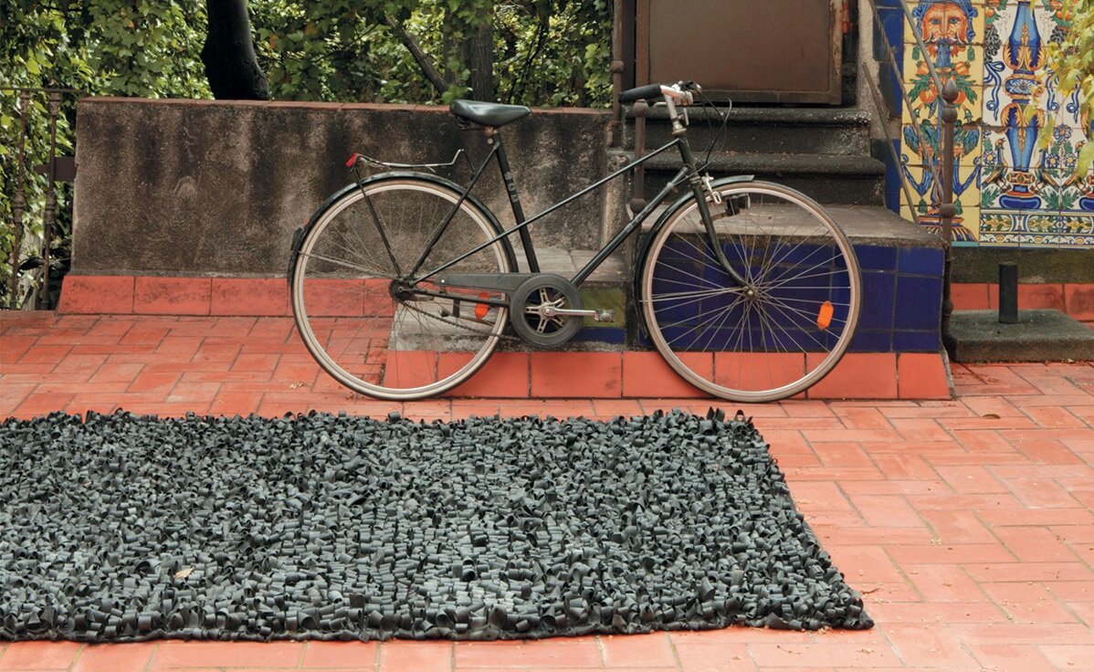 Bicicleta Outdoor Rug. Each rug is made using 130/140 bicycle inner tubes by Nani Marquina, Barcelona, Spain