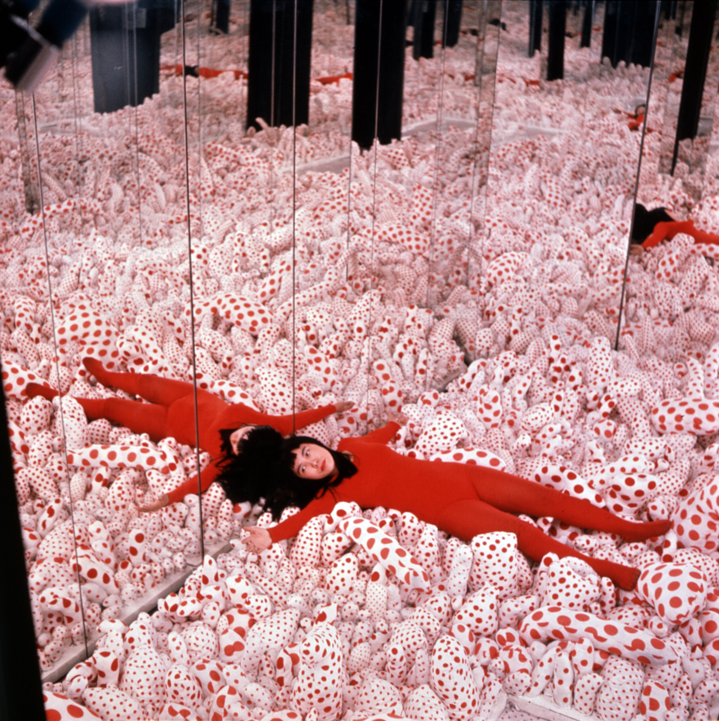 Installation-view-of-Yayoi-Kusama’s-first-–-Infinity-Mirror-Room—Phalli’s-Field-1965-Sewn-stuffed-cotton-fabric-board-and-mirrors-in-Floor-Show-Castellane-Gallery-New-York-1965-.jpg