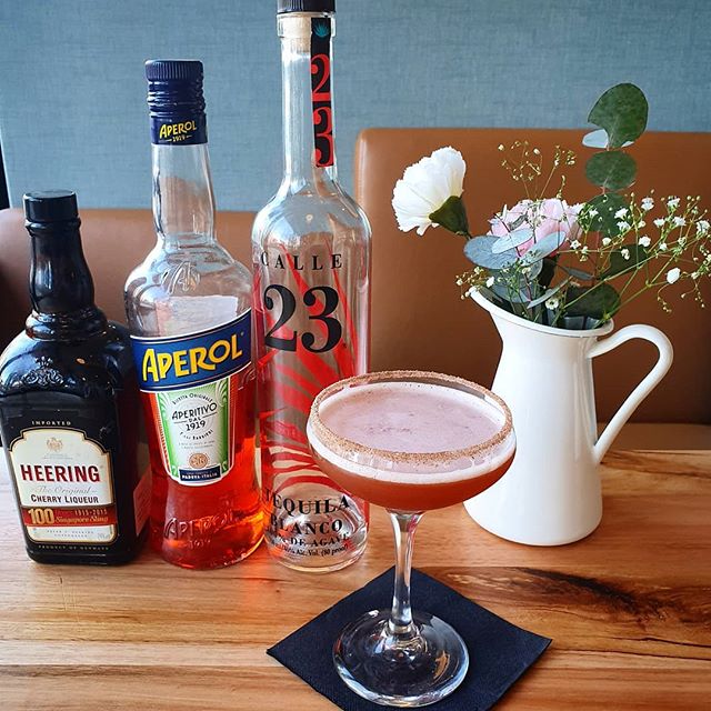 Introducing our throw back series of your favorite cocktails from the old 54 Benjamin bar.
This is &quot;Upstate Agave&quot; Tequila, Aperol, Cherry Heering, lemon with a cinnamon rim. Any requests what's up next?