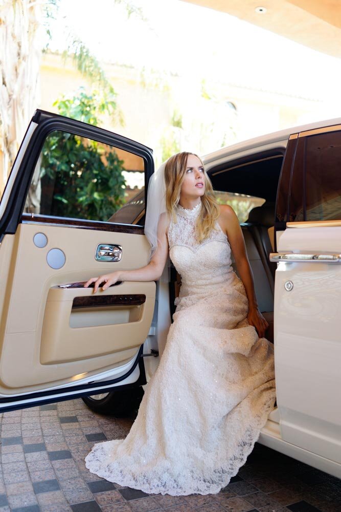 Chantilly lace A-line bespoke bridal dress trimmed with handmade swarovski crystals in a hand built Rolls Royce Ghost.jpg