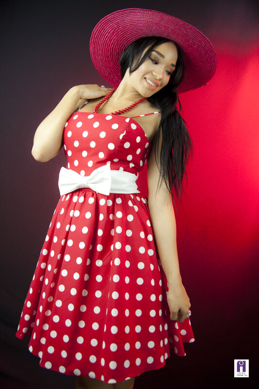 Red polka dots summer style spaghetti straps swing dress with white bow in the waistline and red hat.jpg