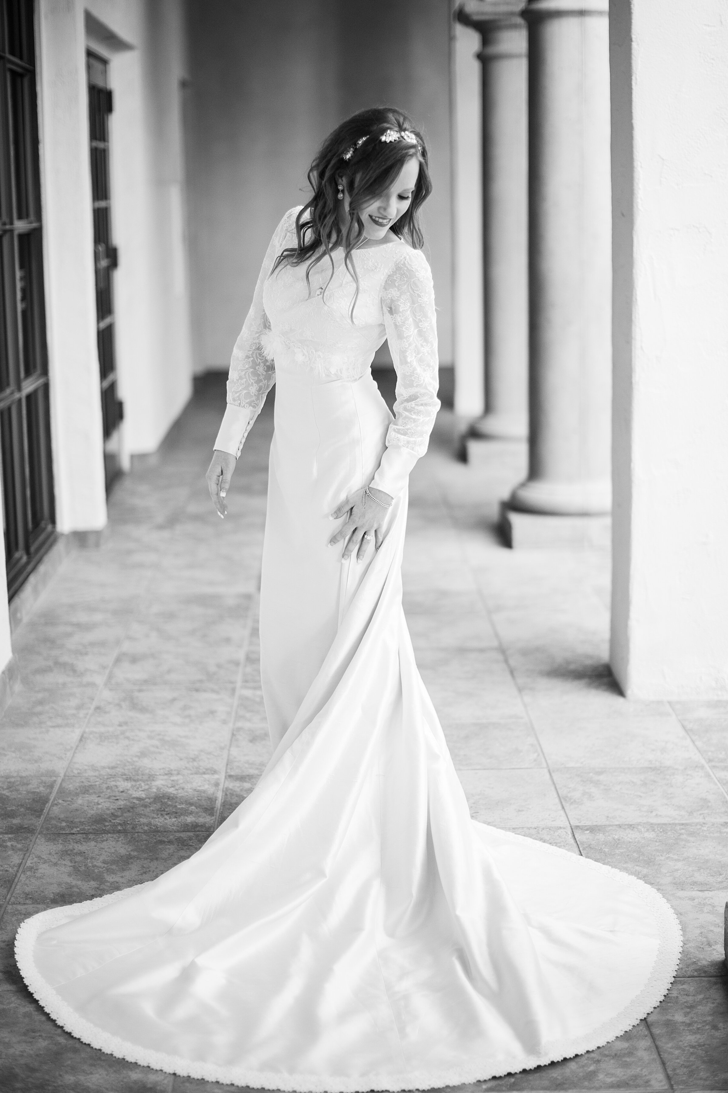 Bride turning back showing off vintage trimmed cathedral train redesigned by Alis Fashion Design.jpg