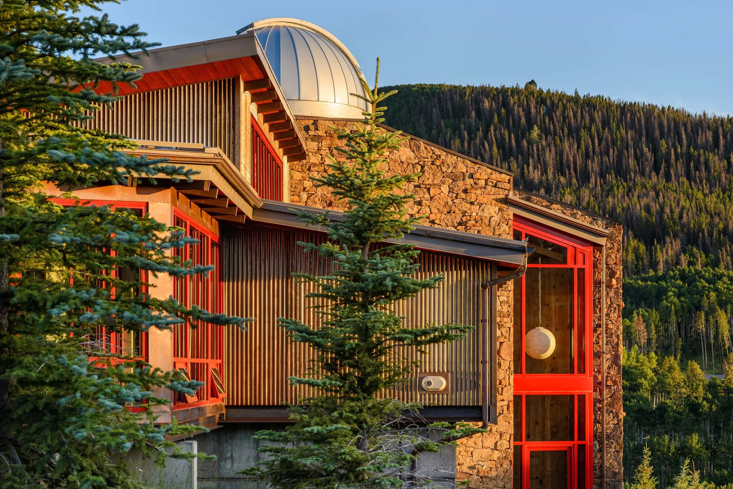 House exterior in the mountain side with trees