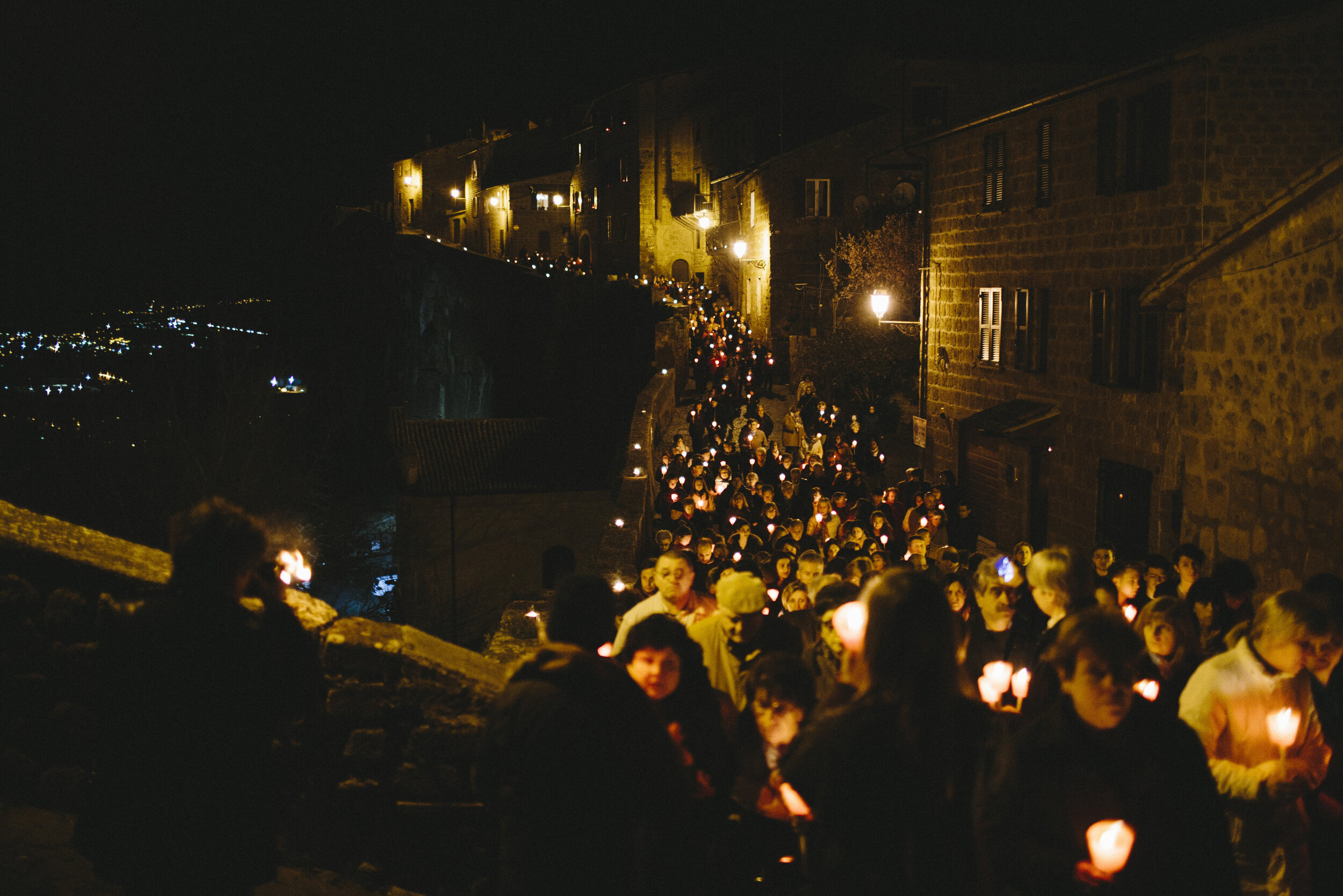  The candle-lit  Via Crucis  winds its way through the Stations of the Cross on Good Friday. 