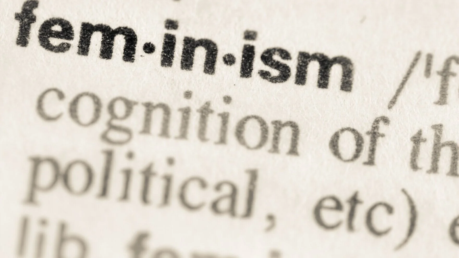 Close-up of a dictionary page with the word 'ten-ism' and its definition.