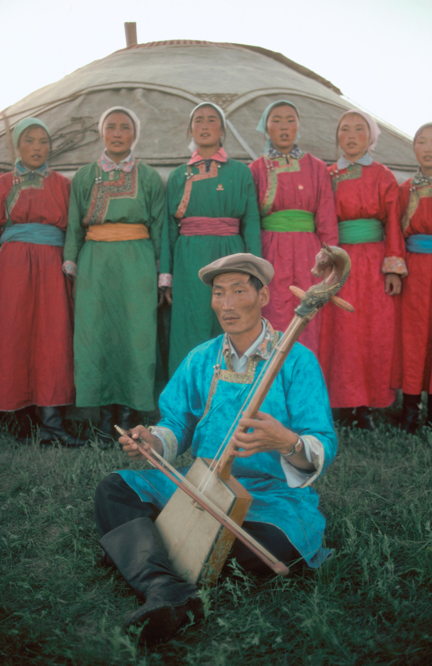 Militia of Golden River White Horse Company singing a folk song. Mongolia. 1979.
