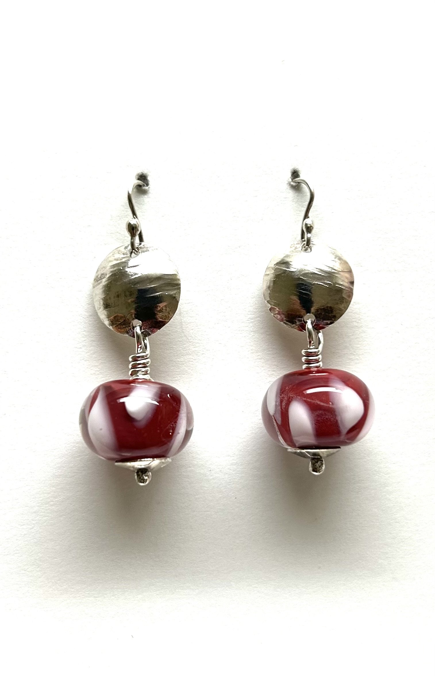 Red glass bead earring.