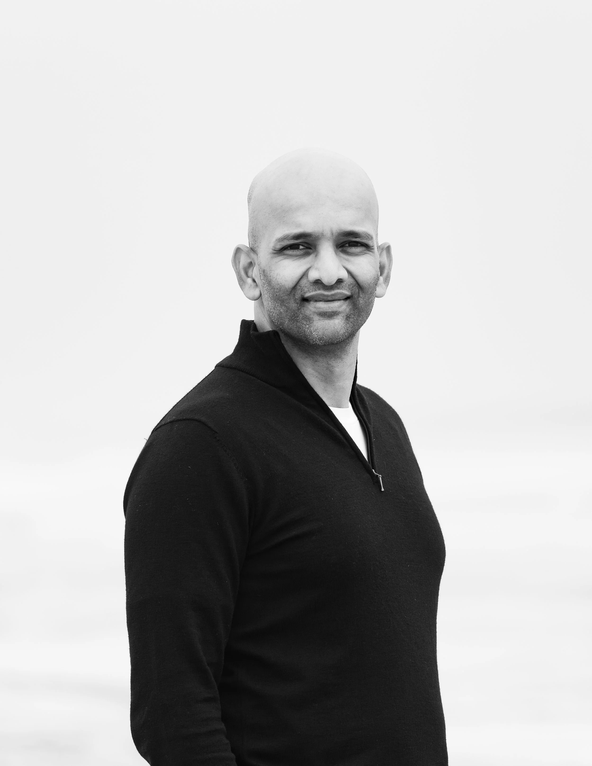 Portrait of a photographer capturing warm, heartfelt moments while using professional photography to support charities and nonprofit causes.