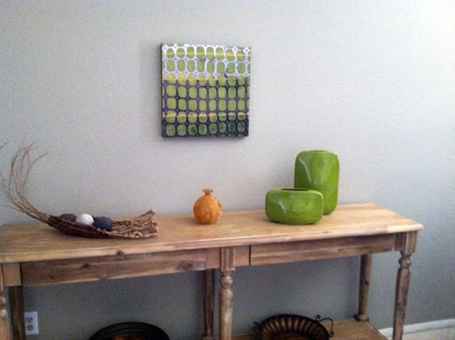 A print on canvas of my painting, Ground Through the Fences #1 , was purchased through Saatchi Art . The original painting is mixed media on 18" x 18" x 1.5" cradled board. Prints at Saatchi measure 14" or 16" square, depending on whether it's on paper or canvas.